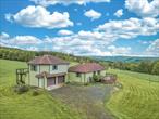 Perched in a peaceful setting with breathtaking, panoramic views, this well-maintained 3-bedroom, 2-bathroom homeâ€”built in the early 2000sâ€”offers comfort, privacy, and room to grow.Start your mornings with coffee in the living room as you gaze out over miles of unspoiled landscape, or enjoy dinner and a BBQ on the spacious deck while watching the local wildlife roam nearby. Inside, you&rsquo;ll find an open-concept living room, dining area, and kitchenâ€”perfect for entertaining or relaxing with family. The home features an upstairs master bedroom with en-suite and a private entrance, ideal for use as a luxurious primary suite or a convenient in-law apartment.Take advantage of an oversized two-car garage with a wood stove, perfect for a workshop or hobby space. A full unfinished basement offering abundant storage or a future living space. A fenced garden with fruit trees for the green thumb in the family. The Town of Franklin has something for everyone. From blueberry picking, golf, village pool, railroad museums and a variety of eclectic shops lighting the village streets (including designer Gary Grahm). Franklin is also home to the one and only Yoko Ono who permanently resides here and can sometimes be seen enjoying the town every now and then. In fact, many of her vacant lots are very close to this house!Four new mini-split AC units for efficient year-round climate control. A new roof and a gorgeous brand-new front deck, perfect for outdoor relaxation.If you&rsquo;re looking for serenity, space, and a move-in-ready home with room to make your own, this property checks every box. Don&rsquo;t miss the chance to enjoy privacy with a view that stretches for miles.