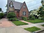 Solid Brick Tudor on quiet residential street Living room W/ Fireplace, Large Formal Dining Room, Den Kitchen w/ separate dining area, full bath3 Large Bedrooms & Full BathClose to LIRRExcellent Merrick School District