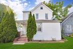 Best location in Hicksville! New Kitchen and New Bath. walking distance to Lirr, Mall and shops. new painting and carpet in one bedroom. private fenced backyard with 2 new car garage door.