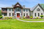 Extraordinary Family Compound or Weekend Retreat in Beautiful LAKE MAHOPAC. This is a rare opportunity to own a truly exceptional estate in LAKE MAHOPACâ€”a magnificent 6-bedroom, 5.5-bath custom-built Colonial with over 6, 000 square feet of elegant living space. Set atop a private road at the end of a cul-de-sac, the home is nestled on 3.47 level, beautifully landscaped acres and includes deeded lake rights to a private 100-foot sandy beach and boat dock on the spectacular, motorboat-friendly Lake Mahopac. The moment you enter the grand two-story foyer; you&rsquo;re greeted by a stunning custom staircase and an abundance of natural light. The interior showcases soaring 10-foot ceilings, elegant arched openings, detailed moldings, and inlaid hardwood floors. The gourmet island kitchen is a chefâ€™s dream, featuring a picture window breakfast area, Sub-Zero refrigerator, Wolf stove, wine cooler, and newly added Bosch microwave, Bosch dishwasher, and GE Profile Advantium double wall oven with European convection, air fry, steam bake, and sous vide modes. A second staircase conveniently connects the kitchen to the upper level. The spacious family room includes a floor-to-ceiling stone fireplace, while the large formal dining room and elegant living room provide perfect spaces for entertaining. A private office completes the main floor. Upstairs, the luxurious primary suite is truly one-of-a-kind. It includes tray ceilings, a large separate sitting room with sliding doors to a beautiful cedar three-season room featuring a propane heater. The oversize spa-style primary bath includes a soaking tub, a separate shower and dual sinks. The primary bedroom includes custom his-and-her walk-in closets with built-in Birchwood cabinetry and another stone fireplace. The second floor also offers a Jack and Jill suite, a Princess suite, two additional bedrooms (one with an en suite bath), a full hall bath, and a laundry room with a brand-new washer. The recently completed lower level adds 1, 492 square feet of finished space with 9-foot ceilings. Itâ€™s divided between a massive recreation/game room with space for a home theater, billiards, ping pong, and more, and a fully equipped accessory apartment with its own bedroom, living room, kitchen, and a spa-like full bath with radiant heated floors. This space is ideal for in-laws, an au-pair, extended family, or guests. A full staircase leads to the expansive attic, which is the length of the home and already floored for storage. The oversized three-car garage includes a second staircase down to the lower level for added convenience. The exterior of the home is finished with durable, no-maintenance Hardiplank siding. The landscaping is professionally designed with custom lighting, a sprinkler and irrigation system, and a newly redesigned and rebuilt driveway and private road lined with elegant Belgian block. At the entrance, new custom-built stone pillars with dramatic lighting make a stunning first impression. Recent additions include a new central vacuum system, stadium-quality outdoor floodlights, a paved area for winter boat storage, and a brand-new Arctic cedar saltwater hot tub (available for purchase). Home has been wired for portable generator hook-up. The entire home has also been freshly painted and is in pristine, move-in condition. Located just a five-minute walk from the private beach and only an hour from New York City, this remarkable property combines the serenity of lakefront living with the convenience of nearby highways and Metro-North access. Whether you&rsquo;re looking for a spacious family compound, an elegant full-time residence, or a luxurious weekend escape, this home offers it all.