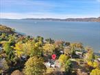 Welcome to 205 River Road, a rare opportunity to own a fully renovated luxury home in Westchester County with breathtaking Hudson River views. This 5-bedroom, 3.5-bath colonial sits on a beautifully landscaped large lot in Briarcliff Manorâ€™s highly desirable River Road neighborhood overlooking the majestic Hudson River, a quiet, tucked-away setting known for its natural beauty, privacy, and proximity to key amenities.Expertly reimagined, this turnkey home offers elegant, modern living across a spacious open-concept floor plan. Four fireplaces and stunning architectural details create a warm yet sophisticated ambiance. Multiple rooms capture tranquil river vistas, bringing natureâ€™s beauty indoors.The heart of the home is a designer chefâ€™s kitchen featuring high-end appliances, sleek custom cabinetry, and a large center island ideal for entertaining. The adjoining sunlit family room with gas fireplace and radiant heated flooring opens to a herringbone brick patio, perfect for al fresco dining with river views.The serene primary suite is a true sanctuary with its own fireplace, spa-inspired en-suite bath, and custom walk-in closet. Additional bedrooms and flexible living spaces offer ample room for family, guests, or home office needs.Enjoy a premier Hudson Valley lifestyle just minutes to the Scarborough Metro-North station for a seamless NYC commute, as well as the Sleepy Hollow Country Club, scenic parks, Hudson River trails, and the charming downtowns of Briarcliff Manor and Ossining.Experience the best of Westchester luxury real estate, a perfect blend of location, lifestyle, and timeless elegance at 205 River Road.Also available for rent with the option to purchase.