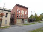 MOTIVATED SELLER! This grand old brick building was once the home for the Monticello Masons and has always been referred to as the Masonic Building . Built, probably in the early 1900&rsquo;s it has a unique architecture in the front. There are three floors each having about 4, 560 sq. ft. for a total if 13, 680 sq. ft. with a full basement. Renovations have been started. There is a new concrete floor in the basement and all the stone walls have been repointed to make them water tight. New sewer pipes have been installed in the basement and a hot water heater. Upstairs there is all new subflooring throughout the building. Some walls were taken out others were reinforced. All the old ceilings were taken out and many rooms have new sheet rock . The top floor, the original home of the Masons, has a large meeting room, still in very good condition. Building has many possibilities, retail or offices downstairs and multiple apartments on the second and three floors is permitted. Located only a few hundred feet from Broadway in the Village of Monticello you are walking distance to transportation, shopping, restaurants and more. Municipal parking very close by. Only 1.5 hours from NYC