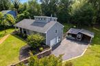 Welcome to this beautifully maintained and thoughtfully updated Cape-style home located in the sought-after Shore Ridge Hills community of Shoreham. Just a short stroll from a private residents-only beach, this property offers the perfect blend of classic charm and modern comfort. Step inside to find gleaming hardwood floors throughout and a stunning, all-new eat-in kitchen featuring granite countertops, custom cabinetry, and recessed lightingâ€”ideal for everyday living and entertaining. The inviting living room is warmed by a cozy wood-burning stove, while a separate den with a wood-burning fireplace provides an additional space for relaxation or gatherings. This spacious home boasts 3 bedrooms, including a generous primary suite complete with a walk-in closet and an updated en-suite full bath. Additional updated full baths ensure comfort and convenience for all. A former garage has been smartly converted into a gym area, offering flexibility for fitness or hobby space. Outside, enjoy the expansive decking that overlooks a fully fenced, beautifully landscaped yardâ€”perfect for outdoor entertaining and peaceful evenings.Additional updates include:Central air conditioning 4years, 4-year-old roof, Detached oversized shed for extra storage, Legal accessory efficiency apartmentâ€”ideal for guests, extended family, or rental income. Private Beach dues of just $350/year