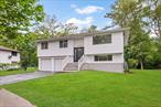 Beautifully Refreshed Hi-Ranch in Harborfields School DistrictWelcome to 155 Brooklyn Avenueâ€”a stylish and thoughtfully improved 4-bedroom, 2-bath home on a spacious .24-acre lot in the heart of Huntington. Set in a sought-after neighborhood, this property offers a harmonious blend of comfort and functionality.Step inside to discover a light-filled layout with updated finishes, modern flooring, fresh paint, and tasteful design touches throughout. The open-concept kitchen features contemporary cabinetry, sleek surfaces, and flexibility for a panel-ready or standard refrigerator.The primary suite offers generous closet space and a calming ensuite with spa-inspired elements. Both bathrooms showcase a clean, modern aesthetic with a cohesive finish.Comfort upgrades include an efficient heating and cooling setup, updated lighting, laundry hookups, and a recently enhanced 200-amp electrical service.Enjoy the peaceful backyard, inviting deck, and proximity to all that downtown Huntington has to offerâ€”restaurants, shops, parks, and entertainment just minutes away.