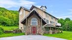 Nestled in Dutchess County, this one-of-a-kind 1780s cattle barn, reimagined as a stunning modern residence, awaits its next occupant to cherish its historic charm and unique character. A picturesque driveway leads to a grand entryway, setting a dramatic tone as abundant natural light floods the open-concept interior, featuring 3 bedrooms and 2.5 bathrooms. Soaring cathedral ceilings highlight hand-hewn chestnut beams, paired with hand-scraped oak flooring throughout. Three expansive decks offer breathtaking views, ideal for sipping morning coffee overlooking the horse barn and paddock or hosting lively gatherings. The master suite, with lofty ceilings, a spacious walk-in closet, and ample light, adjoins a luxurious, spa-like master bathroom for ultimate relaxation. The gourmet chefâ€™s kitchen boasts expansive granite countertops, two sinks, premium stainless steel appliances, and a 6-burner Viking stove. A nearby pantry with laundry room and half bath, discreetly closable with a privacy door, ensures seamless entertaining. The recreation space, family room, two additional bedrooms, and a full bathroom are warmly connected, fostering togetherness. This architectural gem, blending historic allure with modern elegance, is ready for someone to call it home. Schedule your tour now! Showings begin 6/14.