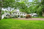 Prime Bedford gated estate on over 15 glorious acres of open, level land with spectacular age old specimen trees. This property is totally private, quiet and is less than 3 minutes to town. It was renovated from top to bottom in 2022 with everything new including kitchen and all baths. The house has a perfect floor plan with gracious formal and family spaces for entertaining inside and out. It includes a beautiful wood paneled library/office with a private entrance, dramatic heated glass conservatory, screened porch with plexiglass panels, a heated gunite pool as well as your own squash court! The first floor guest suite is perfectly tucked away and the finished lower level is multi-purpose. Full house generator. Taxes have been grieved and assessment will be reduced significantly.