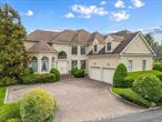 Welcome to 45 Stone Hill Drive, an exceptional Colonial-style residence located within the prestigious gated community of Stone Hill in Manhasset, NY. This elegant home offers about 4, 300 square feet of refined living space(not including the basement), combining timeless architecture with modern luxury. Set within a private, 24-hour guard-gated enclave, the home features 5 spacious bedrooms, 3 full bathrooms, and 2 half baths, all thoughtfully designed for both comfort and entertaining. The dramatic two-story entry foyer leads to gracious formal living and dining rooms, a private library/home office, and a gourmet eat-in kitchen ideal for culinary enthusiasts. The inviting family room boasts a gas fireplace and built-in surround sound system, while gleaming hardwood floors flow throughout the home. Additional luxuries include a custom 8-seat home theatre, a wet bar perfect for entertaining, and a relaxing 4-person sauna. Outside, the professionally landscaped, park-like grounds include an expansive brick courtyard and a custom 2-car garage. Located in the highly regarded Manhasset School District, this distinguished home offers a rare opportunity to live in one of Long Islandâ€™s most sought-after communities, where privacy, security, and sophistication converge.