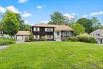 First time on the market! This expansive 4-bedroom, 2.5-bathroom split-level home, featuring a dedicated office and detached 2-car garage, sits on nearly half an acre and offers over 3, 000 square feet of space, with incredible potential. Set on a beautiful, level lot with ample parking in the heart of Yorktown Heights, this home combines generous room sizes, a functional layout, and a location that canâ€™t be beat.Enter through the front door into a welcoming foyer that leads to a comfortable living room, a classic kitchen, and a formal dining area. Sliding doors off the dining room open to a private deck overlooking the stone patio and peaceful backyardâ€”perfect for outdoor dining and entertaining. Just a few steps up, youâ€™ll find three spacious bedrooms, including a primary suite with its own half bath, plus an additional full hall bathroom.The lower level offers wonderful flexibility with a fourth bedroom, a separate office, and an expansive family room that opens directly to the backyardâ€”ideal for gatherings or quiet evenings. A few more steps down, you&rsquo;ll find a laundry room, another full bathroom, and a finished storage area that can be adapted to suit your needs.In addition to the homeâ€™s generous interior space, the property features an oversized two-car detached garageâ€”ideal for car enthusiasts, extra storage, or a potential workshop.While this home could benefit from updates, its solid structure, spacious layout, and unbeatable location close to shopping, parks, schools, and transportation make it a rare and exciting opportunity to own a home in Yorktown Heights and everything this sought-after town has to offer. Bring your vision and make this home truly your own!