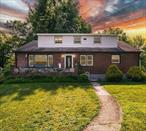 Welcome to this unique and beautifully maintained Cape Cod set on .52 parklike acres. with the award-winning Cornwall School. This versatile mother-daughter home offers both comfort and opportunity with two separate living spaces perfect for extended family, guest, or rental potential. The main home features 3 bedrooms 1 full bath, showcasing warm, sun-filled living spaces, hardwood floors. and classic Cape charm. The top floor has an additional living space featuring 1 bedroom, 1 bath, Kitchen and sitting area, Ideal for In-laws, adult children, guest, or even a home office. Set on a double lot, the property is a gardener&rsquo;s paradise with lush, manicured grounds, beautiful flowering beds, and mature trees offering privacy and year-round beauty. On the second lot, you&rsquo;ll find a barn with garage space and a spacious loft above - ideal for a workshop, studio, storage, or potential conversion. Endless possibilities await. New leach fields and distribution box have been recently installed, offering peace of mind and added value. This home is ideally located close to shopping centers, Restaurants, Parks, Schools, and major commuter routes, making it convenient for everyday living while still offering a quiet and scenic setting. A rare gem with space, flexibility and charm. This property won&rsquo;t last long. Schedule your private tour today and discover all that this home has to offer!