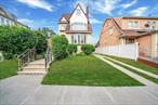Welcome to this beautiful two family colonial home legally converted from one family house. An Amazing opportunity for an owner occupant with income potential or a perfect set up for a mother daughter or investors. The 1st FL features a living room with vintage built in shelving and ample storage cabinets with a working woodburning fireplace. Plenty of natural light coming from the side windows and bay windows of a bonus room ideal for an office or sitting area. It is an open concept from the bonus room to the living room and to the formal dining room with hardwood floors throughout. A beautiful kitchen w/granite countertops with access to the basement & to the side of the house. The first floor offers a great size bedroom with a Jack & Jill bathroom. The 2nd FL offers spacious living room with hardwood floor leading to a sliding door to a great size balcony overlooking the front of the house. An updated kitchen with plenty of cabinets and an island with granite countertops , stainless appliances with built in bar cabinets. A spacious size bedroom and a full bathroom . The 3rd FL has a spacious room with closets and windows. The basement is a walk out and finished with one big sunken room, a half bathroom and utility room. This move in ready home is offering a private driveway that can fit up to 4 cars and a detached garage with great size fenced backyard for your summer entertainment. It is coming with a 5 years old roof, about 10 years old furnace and a year old hot water heater. There are 2 meters for electricity and 1 meter for the natural gas. It is nestled between the border of Jamaica Hills and Jamaica Estates - close to all shopping, the F Train station,  2 great hospitals, St. John University and Jamaica Muslim Center. Showings by appointments only and it must be confirmed with 48 hours notice. Please note - some of the pictures are virtually staged.