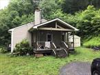 One level living. 2 Acres partially wooded. Lots of privacy. Put in a few updates and a little elbow grease and make this home your style.