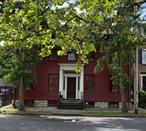 Why settle for ordinary when you can own a historic, versatile, and recession-resistant two-family home in Kingstonâ€™s coveted Stockade Districtâ€”an investment that offers both timeless charm and modern financial security?Welcome to this stately Colonial in Kingston&rsquo;s historic Stockade District, where timeless elegance seamlessly blends with modern versatility. Built around the 1830sâ€”though recorded as 1900â€”this impressive 2, 773 square foot residence exudes period charm, featuring soaring 10-foot ceilings and elegant light fixtures throughout. Its spacious floor plan includes 4 bedrooms and three full baths, complemented by two cozy fireplaces, creating a warm and inviting atmosphere.Located in one of Kingstonâ€™s most desirable neighborhoods, this legal two-family home offers exceptional flexibility and resilience in any economic climate. Whether you choose to use it as a single-family residence or as a rental investment, this property is designed to generate steady income and withstand market fluctuationsâ€”making it a truly recession-resistant asset. The rear unit, with its own heating system and electrical meter, currently rents for $1, 650 month-to-month, providing immediate cash flow. The main houseâ€™s adaptable layout also lends itself to use as multiple offices or a combined living and working space, catering to todayâ€™s evolving lifestyle needs.The two-car garage with a loft presents further potentialâ€”convert it into a separate living unit or an income-generating rental to maximize your investment. The kitchen in the main house has been stripped of old appliances and is ready for remodeling to suit your personal taste. Recent upgrades include state-of-the-art furnaces for each unit, updated electrical systems (100 Amp for the apartment and 200 Amp for the main house), new copper gutters and downspouts, and freshly painted interior and exterior surfaces.Furthermore, this property benefits from **T5N zoning**, which permits a diverse mix of residential building types, general retail, and small to medium-sized neighborhood supporting services and commercial uses. This flexibility adds to the unique â€œgo with the flowâ€ potential of this historic propertyâ€”allowing you to adapt and expand your investment in ways that best suit your goals.**As an added incentive, the sellers are offering to purchase 1 mortgage point for buyers.**Investing in 8 Pearl Street not only secures a beautiful historic property but also diversifies your portfolio with a resilient, income-producing assetâ€”perfect for those seeking stability in uncertain economic times. Experience the perfect blend of historic charm and modern opportunity that makes this property a standout in Kingstonâ€™s vibrant community.