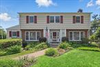 Welcome to this beautifully preserved and tastefully updated 1958 center-hall Colonial, nestled in the heart of Peekskill&rsquo;s sought-after Mortgage Hill neighborhood. With 4 bedrooms and 3.5 baths, this gracious home is a seamless blend of classic design and contemporary comfort. On the main level, a front-to-back living room with enough space for a grand piano invites gatherings and quiet moments alike. French doors lead to a serene screened porchâ€”perfect for summer evenings. The charming pine-paneled den also opens to this relaxing outdoor space. A large dining room sets the stage for entertaining and flows easily into a chefâ€™s kitchen, featuring stainless steel appliances, oversized island, double sinks, and skylights that bathe the space in natural light. A discreet main floor laundry and full bath offer convenience and thoughtful design. The second floor features a spacious primary suite complete with a walk-in closet and private ensuite bath. Down the hall, a stunning cerulean blue, mint-condition 1950s bath offers a splash of vintage style, complemented by three additional well-appointed bedrooms. The full walk-out basement includes a half bath, ample space for hobbies or storage, and access to a covered patio and two-car garage. Modern upgrades include a whole-home generator, ensuring comfort through every season. Outside, manicured garden beds and mature plantings create a picture-perfect setting. The level yard is a gardenerâ€™s delight, with a fully fenced vegetable garden. Located just minutes from Peekskillâ€™s vibrant downtown, the Metro-North station, riverfront parks, local shops, and restaurantsâ€”this home is not only a retreat but a gateway to the best of Hudson Valley living. Donâ€™t miss your chance to own a true classicâ€”where timeless charm meets modern living.