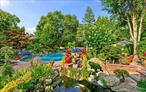 Welcome to your private oasis in the heart of the Half Hollow Hills School District! Tucked away on a QUIET cul-de-sac, this immaculate 5, 000+ square foot contemporary colonial offers the ultimate in luxury living and resort-style amenities, set on a magnificently landscaped property that feels like a five-star retreat. Step into the grand two-story foyer and immediately sense the refined elegance and perfect flow of this beautifully maintained home. Designed for both comfortable living and stylish entertaining, the spacious layout includes a private guest ensuite on the first floor, four fireplaces throughout, and generously sized rooms bathed in natural light. At the heart of the home lies a stunning, fully renovated eat-in kitchen featuring sleek white cabinetry, gleaming countertops, a massive center island, high-end appliances, cooktop, and a built-in BBQâ€”perfect for hosting and gourmet cooking. Upstairs, the luxurious primary suite is a true sanctuary, boasting a separate sitting room, a jaw-dropping custom walk-in closet with built-ins, and a spa-inspired bath complete with a jacuzzi tub. All additional bedrooms are spacious and beautifully appointed, offering comfort and privacy for everyone. The true showstopper is the extraordinary backyard. Multi-level and masterfully designed, this private resort paradise includes an outdoor kitchen with a pizza oven, charming gazebos, tranquil koi pond, multiple sitting and lounge areas, and a spectacular in-ground saltwater gunite pool with a swim-up bar. Whether you&rsquo;re entertaining or unwinding, every day feels like a vacation.