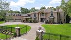 Architectural Masterpiece in the Heart of Dix HillsTucked away at the end of a quiet cul-de-sac, this stately all-brick estate offers the ultimate in privacy, luxury, and timeless design. Set on a 1 acre lot, this custom-built residence is a rare blend of grand scale and warm eleganceâ€”perfect for both everyday living and high-end entertaining.With 6 spacious bedrooms, 6 full luxury designer bathrooms, and 2 elegant powder rooms, every inch of this home has been thoughtfully curated. All bathrooms are finished in rich onyx and marble tile , bringing spa-level sophistication to your daily routine.Inside, youâ€™ll find 5 gas fireplaces throughout the homeâ€”each convertible to wood-burningâ€”creating warmth and ambiance in all the right places. The home features a first-floor primary suite, ideal for guests as well as a true primary retreat on the second level with spa bath and generous closet space.An impressive library, ideal for a home office or reading sanctuary, anchors the main level, while the fully finished basement offers a custom wine cellar and versatile entertaining space.Step outside to your own private resort:  â€¢  A resort-style pool with hot tub spa and dramatic waterfall feature  â€¢  Beautifully landscaped grounds with a tranquil coy pond  â€¢  Full pool house, outdoor kitchen, a cozy fire pit and fireplace, 2 outdoor gazebos and 3 pergolasâ€”perfect for unforgettable summer nights  â€¢  Two gated entrances offering privacy, security, and dramatic curb appealOther notable features include a 3.5-car garage, 78 owned solar panels, and full brick construction from front to backâ€”showcasing quality and craftsmanship that will stand the test of time.This home is not just a place to liveâ€”itâ€™s a lifestyle. A true sanctuary, nestled in one of Dix Hillsâ€™ most sought-after locations.