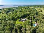 Steeped in provenance, Rabbit Hill is the quintessential Hudson Valley estate. Set atop 22 acres with a spectacular view of the river, the house was designed by prominent architect Mott B. Schmidt for banker Willian S. Lambie. Completed in 1929 and meticulously restored in 2016,  the house has a rich history and most recently served as a principal location for the Robert Deniro/Netfilx series Zero Day. The land is deeply private-a glorious tableau of sweeping lawns, perennial gardens, and quiet woodlands. Fenced and gated, the property begins with a quarter-mile long driveway leading through towering oaks and a stunning naturalized landscape. A lovely fountain centers the formal courtyard at the front entrance. The sprawling mansion comprises over 13, 000 square feet on four levels. The interior embodies architect Schmidt&rsquo;s signature style and symmetry. Despite its size, the home lives on a human scale. A stair hallway reveals a curved floating staircase over a herringbone brick floor. The sunken family room includes three garden exposures through six over nine divided-light windows. The newly renovated kitchen tastefully presents a modern aesthetic while respecting the home&rsquo;s integrity. The second level includes six en-suite bedrooms, an additional guest room with private bath, and spacious office with full bath. The grounds are immaculate. A 100 foot terrace, large pool house, and a 50 foot pool all face south and west towards the Hudson and Palisades beyond. Adjacent to the The Sleepy Hollow Country Club, Rabbit Hill is an extremely rare offering and opportunity of a historic house and property in superb condition and just 30 miles from Midtown Manhattan.
