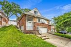 Welcome to this move-in ready split-level brick home in Glen Oaks offering bright, spacious interiors across five levels â€” perfect for flexible living and entertaining.The open-concept main floor features a renovated kitchen with sleek white cabinetry, quartz countertops, stainless steel appliances, and a center island that flows into a sunlit living and dining area with hardwood floors and oversized windows.Upstairs include comfortable bedrooms, a modern full bath with double vanity, and access to a screened-in porch overlooking the expansive backyard. A private top-floor bedroom makes a great guest suite or home office.The garden level includes a family room, stylish wet bar, renovated second full bath, and a versatile finished room with a separate entrance â€” ideal as a creative space, gym, or office. The home also includes a laundry area, two-car garage, and generous storage.Enjoy year-round comfort with a ductless mini-split A/C system and relax in the fully fenced, oversized yard â€” perfect for entertaining or recreation. Located near schools, shops, and major roads, this home blends comfort, convenience, and value.