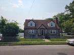 Huge Cape just hit the market! Hugh 4-bedroom, 2 full-bath home sits on a generous 60x100 corner lot with attractive brick and stone facing and desirable East exposure. Enjoy an open-concept kitchen filled with natural light, hardwood floors throughout, and 5 ductless A/C units. The home features gas and steam heating, washer & dryer, high ceilings on every level, and a finished basement with high ceilings â€” perfect for extra living space. The first floor offers 2 bedrooms and 1 full bath; the second floor has 2 additional bedrooms and 1 full bath. A large driveway easily fits 4+ cars. Freshly painted with tons of potential. Near schools, shops, public transportation, and all.