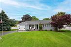 A rare opportunity to own a gorgeous fully-furnished, meticulous, move-in ready charming ranch located in the private beach community of Patchogue Shores! Tastefully renovated in 2017, this 2-3 bedroom, 1.5 bath home has been professionally designed for cozy comfort, coastal style and easy single-level living. Upon entry from the picturesque front porch, the spacious living room welcomes you with its oversized, bright bay window, decorative shiplap wall, rustic wall storage system and hardwood floors. The eat-in-kitchen kitchen features stainless steel appliances, durable butcher block countertops, decorative shiplap wall and coastal mist cabinetry. French doors lead to the inviting sun-filled room with classic wood burning fireplace, massive double-sided closet, recessed lighting and French doors overlooking the expansive wood deck and patio. The oversized primary bedroom has been converted from two bedrooms into one with an expansive wall-to-wall closet, abundance of natural light with 2 sets of double windows and easy access to all rooms. The second spacious bedroom has 2 generously-sized closets and is conveniently located next to the farmhouse-designed full bathroom with a soaking tub. Modern farmhouse style continues into the laundry room located next to the attached one car garage. Immaculate hardwood floors are located throughout the house. A private backyard oasis has been designed for pure relaxation or entertaining especially with its new, unique, authentic stone wood-burning pizza oven perfect for al fresco dining and the built-in grill island ready to host summer BBQs! The expansive wood deck is conveniently located off the kitchen, making outdoor meals and gatherings a breeze. Fully fenced-in, this flat quarter acre property has been professionally landscaped with a variety of lush, mature specimen plantings outlining the entire backyard. Patchogue Shores includes private security, access to the beach, clubhouse and private marina (fees). Whether you are a first time home buyer or looking to downsize, now is the time to embrace the opportunity to unpack your bags and make this coastal beach home your cherished retreat. This move-in ready gem with coastal charm is the best of exclusive beach town living!