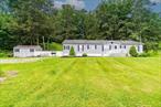 Experience serene country living at 3465 Route 22, Dover Plains, NY 12522! This spacious, well-maintained ranch-style home offers the perfect blend of comfort and style, set back from the road for privacy and boasting breathtaking panoramic views of the surrounding Hudson Valley landscape. Step inside to discover a bright and inviting living room, complete with a cozy fireplaceâ€”perfect for relaxing evenings. The open-concept center island kitchen is ideal for entertaining, featuring ample counter space and modern appliances. The master suite is your personal retreat, with plenty of closet space. With two bedrooms plus a versatile den (perfect for a home office or guest room) and two full baths, thereâ€™s room for everyone. Enjoy the outdoors from not one, but two spacious decksâ€”ideal for morning coffee or sunset gatherings. Central A/C keeps you comfortable year-round, and a handy storage outbuilding provides extra space for all your needs. Located just minutes from local favorites like McEnroe Organic Farm Market, Four Brothers Pizza Inn, and the Dover Plains Metro-North station, this home offers both tranquility and convenience. Donâ€™t miss your chance to make this beautiful ranch your new homeâ€”schedule a tour today!