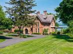 Overlooking the Hudson River in the esteemed hamlet of Balmville, this Gothic Revival masterpiece, The Rest is a rare and remarkable offeringâ€”an enduring symbol of 19th-century architecture, masterfully adapted for modern living.Commissioned in the 1860s by Daniel Bennett St. Johnâ€” Congressman, Senator, and a founding editor of The New York Timesâ€”this estate was brought to life by Frederick Clarke Withers, a leading figure in American Gothic Revival architecture and influenced by Calvert Vaux, co-designer of Central Park. The Rest was designed as both a living work of art and an inviting home.The home celebrates the ethos of High Victorian Gothic Revival showcasing soaring tracery ceilings, gasolier-style chandeliers, floor to ceiling doors adorned with wood-framed diamond-patterned glass, and a Tiffany-style stained-glass window at its heart.Rich inlaid and parquet floors, full-height wood wainscoting, and pocket doors feature prominently in the entry hall, drawing room, library, and dining room. Six original marble and wood fireplace mantels anchor the home. Glass-front-built-ins and intimate mullioned bay window seating invite the sharing of secrets.Befitting its name, The Rest is an approachable home, grounded in comfort with expansive views of the Hudson from a bluestone veranda spanning the western facade.A butlerâ€™s pantry connects the formal dining room with a chefâ€™s kitchen featuring granite counters and river views, warm living room with wide wood plank floors, powder room, and access to the heated pool. The second floor offers a primary suite with views of the Hudson and a custom dressing corridor. The spa-like ensuite has a double vanity, quartz counters, bidet, and soaking tub with river views. The second floor is complete with four additional bedrooms and a bonus room, two with river views, and two more full baths. The upper floors are connected by a discreet secondary staircase and anchored by a traditional oculus or â€˜roof lanternâ€™ that beautifully filters daylight down to the floors below.