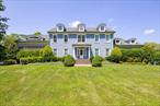 Welcome to this stunning colonial-style residence, beautifully situated on 6.26 acres in the scenic HudsonValley. This exceptional home greets you with a grand entrance, as pink cherry blossoms line thedriveway leading to a spacious three-car garage, while elegant Japanese Red Maples frame the street.Zoned for up to four horses, this private estate offers a perfect blend of charm and functionality. The in-ground pool, surrounded by view fencing, is ideal for relaxing and entertaining. Enjoy the serenity of alush, manicured lawn, vibrant gardens, and two brick patios, one featuring a full wood-burning fireplace.A full-length deck provides access to the interior and includes access to the half-bath for convenience.Inside, the home welcomes you with a graceful staircase, flanked by ornate arched entries leading into thelarge kitchen, seating/dining room and double French door entries into Grand Family Room withfireplace. Optional room can be used as guest bedroom/playroom or an office with French doors, perfectfor flexible use.The chefâ€™s kitchen is outfitted with solid cherry cabinetry, marble countertops, and stainless steelappliances, including a propane 5-burner island cooktop with seating for up to eight guests. A spaciousdining area flows into the Grand Family Room, showcasing 17-foot cathedral ceilings, wood-burningfireplace, arched features, double French doors and an abundance of natural light through multiple largewindows and skylights. Hardwood flooring flows throughout the main level.Additional main-level features include access to the garage, a half bath with washer/dryer hookups, anddirect entry to the rear deck.Upstairs, the primary suite is a luxurious retreat with soaring ceilings, custom arches, French doors, walk-in closets, and a spa-like bath with dual vanities, clawfoot soaking tub, walk-in shower, and private watercloset. Down the hall is an office with built-in bookshelves, a full bathroom, dedicated laundry room, utility nook with a sink and microwave, two additional bedrooms, and a second suite complete with fullbathroom.The fully finished basement includes 8 foot ceilings, a full bath and generous storage options.Located near a golf course, parks, top-rated schools, shopping, and fine dining, this extraordinaryproperty offers timeless elegance and modern convenience in one of the Hudson Valleyâ€™s most sought-after communities.