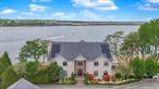 Exceptional Waterfront Estate with Private Dock - Just 40 Minutes to Manhattan by Boat. Calling all Beach and Boating Enthusiasts! Positioned on a sprawling private retreat with an impressive 700 feet of water rights, this stunning Center Hall Colonial offers panoramic water views throughout the home. Designed for both relaxation and entertainment, the home features: 4 spacious bedrooms, 5 luxurious bathrooms, 3 fireplaces and 3 kitchens. Relax in the luxurious primary suite, which opens onto a private deckâ€”one of five throughout the homeâ€”each offering sweeping ocean views. The fourth-floor fitness center provides an equally inspiring backdrop for your daily workouts. A ground level suite offers a custom kitchen, ocean views, a steam bath and a full service bar with ample seating. Relax in your private cinema with luxury reclining seating and surround sound. The outdoor amenities are equally spectacular, including: Your very own private dock accommodating up to 3 boats and 2 jet skisâ€”a short boat ride away to New Jersey&rsquo;s local spots and Restaurants. A fully appointed outdoor culinary space featuring dual grills (gas and charcoal), a smoker, wet bar, and three televisions for ultimate entertaining&rsquo;&rsquo;Heated in-ground pool with waterfall An array of beachside recreational options including a full basketball court, volleyball net, cozy fire pit, and a designated space for clambakes. A Jacuzzi perfectly positioned to capture stunning sunsets. Golf enthusiasts will appreciate the private driving range. Mornings begins with the serene sights and sounds of nature- swans, eagles, and the occasional visit from dolphins and seals along the shoreline. This Oasis is also equipped with: Custom hardwood floors and 2x6 framing with spray foam insulation. Commercial-grade 400-amp electric panel and galvanized wall-grade steel beams. Newer roof, solar panels, and two boilers with a lifetime warranty.Whole-property has Wi-Fi with six zones for connectivity.A generous three-car garage ideal for automotive enthusiasts or extra storage.Exceptional in every sense, this remarkable estate stands in a class of its own. Offering an unparalleled blend of land, location, and luxury, this 1.5-acre waterfront property with 700 feet of water rights is a truly one-of-a-kind opportunity.Contact us today to schedule your private tour and experience this exceptional home firsthand.