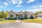Welcome to 138 Lydon Lane in the Hudson Valley. This home is completely updated and move-in ready with no additional expenses to budget for. Relax and unwind as you head up the paved driveway through your own private, 48 acre forest. Opportunities for snowshoeing, cross country skiing, sledding and even paddle boarding on your own private pond await. As you enter through the custom leaded glass front door, you are greeted with the colors of your natural surroundings with soothing green walls that accentuate the dark wood of the floors and custom millwork throughout, giving the home a Craftsman feel with a modern touch. Several large Palladium windows and two skylights provide abundant natural light throughout the home. The living room features a vaulted ceiling with a cozy fireplace and built-in reading nook. A chef&rsquo;s kitchen is complete with custom cabinetry, quartz countertops and new appliances. Flanked on each end are areas for dining and conversation, making this is a perfect space for entertaining. The adjoining dining area off the living room leads directly out to the patio. The two full bathrooms on the main level have new cabinetry, countertops, tubs and showers. The fully finished basement with high ceiling adds another 2, 000 square feet and includes three storage closets, a third full bathroom and a huge area that would be perfect as a playroom, home movie theater or gym. Bilco doors provide separate access to the outside. An oversized mudroom opens out to a fenced blue stone patio with a large covered pavilion, complete with overhead fans and lights. At the end is a substantial wood burning fireplace. The 1-1/2 acre backyard is securely fenced and offers a great space for kids and pets to play. Just across the driveway is a beautifully finished accessory building that offers almost 1, 800 additional square feet. The use of this building is limited only by your imagination. Zoned for business, it can be used for a commercial enterprise, or an incredible recreational space. It has a very large room with washer/dryer hookup and utility sink. There is an open plan living and kitchen area featuring new cabinetry and quartz countertops. A full bath and multiple office and storage rooms complete the first floor. The second level is a charming, knotty pine studio that can be accessed from the inside, or from an outside private stairway. Behind the building is an oversized carport that can accommodate up to a Class A RV. 138 Lydon Lane is just 30 minutes from Hudson and Albany and their Amtrak stations, and a 2-1/4 hour drive to mid-town Manhattan. So, if you&rsquo;re looking for privacy, acreage and a turn-key home with a studio, then this is the property for you.