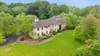 Best opportunity in a long time for the lucky Buyer to purchase not only a mansion, but one with the lowest property taxes in posh and exclusive estates in Lower Westchester. Purchase is located just North of Harrison and enjoys the very good school district of Harrison. This modern and fully updated mansion is less than twenty years old. The almost new swimming pool is only a few years old. This house is perfect for the large family and/or Business Company Executives needing the perfect quiet and serene environment and yet very close to all forms of transportation, including being only less than fifteen minutes to the White Plains Airport, two to three minutes to Highways and only a few minutes&rsquo; drive to either Harrison and/or White Plains Metro North train stations with about 35 minutes train ride to Manhattan&rsquo;s Grand Central Station. This house has a sauna in the basement, a full bathroom, an extra-large industrial wine rack, and an opportunity to re-install the personal elevator from the basement to the two higher floors. This mansion occupies a lush land acreage of 2.50, with a private gated access to only two mansions. This large house has 10-foot ceiling, beautiful French double doors from both the kitchen and the family room that opens onto the large patio for family and friends&rsquo; entertainment. Some parts of the house have limestone floors; main bedrooms level offer real hardwood floors and marble baths. The five bedrooms are all ensuites. Some of the bathrooms are made of marbles. The spacious and beautiful master bathroom also comes with a comfortable and healthy steam shower. There are three heated car garages and additional parking for over six cars. This magnificent home also boasts of top of the range Jeld-Wen windows. Owner has priced this beautiful home for quick sale. The Buyer may also want to finish the basement that could easily provide a large nursery and play area for young children. So please do not hesitate, call today to begin the purchase process and soon, you may be enjoying this beautiful stone and stucco magnificent home.
