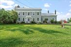 Renovated 1850&rsquo;s farmhouse on 50 acres with retreat barn & stunning views!Historic charm meets modern updates in this beautifully renovated farmhouse, set on 50 private acres with sweeping views. Featuring original wide-plank hardwood floors and a newly updated gourmet kitchen, this home offers rustic character with thoughtful improvements. Some finishing work remains, offering an opportunity to make it your own.Currently used as a yoga and mindfulness retreat center, the property includes a brand new 30X32 barn, ideal for events, workshops, or studio space, plus a 40X40 fully enclosed garden. Rolling fields and open skies make this an exceptional setting for a private residence, retreat venue or creative business venture.