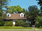 Opportunity knocks in Elwood! Expanded Cape 4 Bedroom on corner lot, curbs and sidewalks, Driveway on Lefferts,  Living Room, Dining Room, Eat-in kitchen, Hardwood Floors throughout, Full Basement, C/O for Converted Garage attached to dwelling for Physicians Office, Updated gas heating system, Hot water storage tank 50 gallons- 5 years, Partially Fenced Yard. Shed in Yard