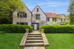50 Overlook Drive, an elegant 6-bedroom colonial Tudor set in a quiet, tree-lined neighborhood. With fresh upgrades completed this month, including interior repainting, carpet-removal to expose wood floors. This one-of-a-kind home is a must see. Meticulously maintained heating and cooling systems, brick exterior, and a classic-tile roof are some of the exceptional features this home can offer. Homes built to this quality are a rare find. Constructed in 1929, the home is also graced with soaring ceilings, intricate period moldings, and expansive sunlit interiors.Designed for both grand entertaining and comfortable living, this spacious home is roaring with charm and can suit a variety of tastes and living styles. The first floor offers a living room with fireplace, an all seasons sunroom, a bright and airy dining room, a kitchen with pantry and wet-bar, a half bath, and an in-law or au pair suite with a full bath. Upstairs features 5 bedrooms and 3 full baths, a grand hallway, and attic access. Additional recreational space is provided in the finished basement, with a family room, a gym, and large mudroom, a half-bath, and a utility room.The beautifully landscaped 1.2-acre lot boasts stunning specimen plantings and a private stone patio adjacent to the all-seasons sunroom. There is also a charming bridge, designed by renowned architect Ned Baldwin, leading to a park-like setting in the backyard. This is an incredible opportunity to own a truly distinguished home in one of Chappaquaâ€™s most desirable neighborhoods. Experience the perfect balance of classic architecture and modern luxury in this extraordinary residence, in a home that is built to stand the test of time.