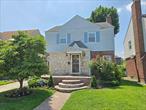 This lovely colonial located in prime fresh meadows 1 block north from St. Johns university offers a great opportunity for new buyers. Located on 174th street, a quiet one way street provides a tranquil neighborhood feeling. As you pull up to the home you are greeted with lovely curb appeal including nice landscaping and a lovely front brick porch. You first enter the home into an entry foyer that contains half a bathroom as well as a coat closet. Connected to the foyer is a large living room that stretches from the front of the house all the way to the back with screen sliding doors providing access to the back patio. The first floor has plenty of windows providing a lot of natural light accompanied by recessed LED lights. To the side of the living room you have a formal dining room connected to a kitchen that is separated by an eating counter providing an open connection feel. The kitchen provides plenty of cabinet space with a large fridge/freezer and a dishwasher. From the kitchen is a door that leads to the backyard as well as a fully finished basement. The beautifully finished lower level expands the homes live able square footage offering a bright open space for a family room and also contains a laundry area, a full bathroom, and room that can be used as a bedroom or office. Upstairs contains newly polished wood floors with 3 large bedrooms and a full bath. The full bath upstairs is also quite large with a separate stand up shower from the bathtub with a large vanity. In the rear of the house you have a raised patio connected to the home leading to a large open well manicured backyard perfect for enjoying the New York summers.