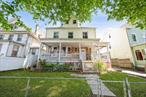 This grand and charming single-family home is full of character, from the large wraparound porch to the original fireplace in the living room. With seven bedrooms and two full baths, thereâ€™s plenty of space to live, work, and grow. The main floor features a warm and inviting layout, complete with a dedicated dining room, kitchen, and full bathroom. Upstairs, youâ€™ll find the primary bedroom and three more bedrooms, plus a full bath. The top floor adds even more flexibility with two bedrooms, a den, and a bonus roomâ€”perfect for a home office or guest space. The spacious backyard invites outdoor fun and entertaining. Located just minutes from shops, parks, and the train, youâ€™re only 25 minutes from Grand Central Station. Come see how easily this special home could be yours!