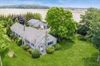 This sun-filled ranch retreat blends timeless charm with modern flexibility set within a conservation-rich stretch of Oregon Road. Surrounded by preserved farmland, this 4-bedroom, 3-bathroom modern farmhouse includes a legal attached guest suite, perfect for multi-generational living, guests, or a private work-from-home space.Enjoy open, airy interiors filled with natural light, spacious living and dining areas, and beautiful outdoor potential with room for a pool. The detached garage offers additional storage or creative use options.With privacy ensured in perpetuity and just moments from beaches, vineyards, and farmstands, this property offers the perfect North Fork lifestyleâ€”peaceful, practical, and picturesque. Public Water available