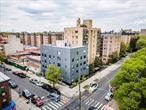 Discover this brand-new condo located in the vibrant heart of downtown Flushing, offering a rare 20-year tax abatement. With soaring 16-foot ceilings, this residence features two spacious bedrooms and a beautifully designed two bathrooms with contemporary tile work and stylish lighting fixtures. The modern kitchen is equipped with sleek stainless steel appliances, combining elegance with functionality. The unit offers $1113 gross square feet and $943 interior square feet, providing a comfortable and efficient layout. Enjoy views of the parking area and the unbeatable convenience of being just a short walk from Main Street and the 7 train station.
