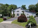 HUGE PRICE IMPROVEMENT! Welcome to this stunning contemporary center hall colonial located in a peaceful cul-de-sac within the highly sought-after Clarkstown School District! This remarkable home boasts over 5, 000+ sq ft of living space, including the extended finished walk-out basement, 5 spacious bedrooms, and 4 full bathroomsâ€”ideal for multi-generational living.As you enter, you are greeted by a grand foyer that leads into a warm and inviting living room complete with a cozy wood-burning fireplace. The elegant separate dining room is perfect for hosting dinner parties, while the eat-in kitchen, adorned with granite countertops and stainless steel appliancesâ€”including a Sub-Zero refrigeratorâ€”flows seamlessly into the family room. An office alcove provides a quiet space for work or study.The second floor offers 4 generously sized bedrooms and a well-appointed hallway bath. The sprawling primary bedroom suite is a true retreat, featuring an en-suite bathroom equipped with double sinks, a luxurious jetted tub, a shower, and an expansive walk-in closet.The finished walk-out basement is a standout feature, boasting approximately 1, 000+ sq ft of additional living space, including soaring 20 ft ceilings in one area and a wet bar, making it the perfect spot for entertaining, a home office, exercise room, game room, or any other creative use you can envision. A full bathroom adds to the convenience of this fantastic space.Additional highlights include gleaming hardwood floors throughout as seen, central air conditioning, built-ins, recessed lighting, and ample storage throughout the home. The large fenced backyard is perfect for outdoor enjoyment, featuring an oversized paver patio, a circular driveway with abundant parking, and a two-car garage.This home is truly a gem and is sure to impress. Donâ€™t miss the chance to make it yoursâ€”schedule a visit today!