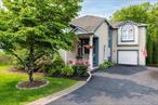 Welcome to this stunning contemporary colonial located on a quiet cul-de-sac in the desirable Hunters Run community. This 4-bedroom, 3.5-bath home features beautiful hardwood floors throughout, central air conditioning, and an attached garage for added convenience. The chefâ€™s kitchen opens to a dining room with a cozy fireplace and walk-out deck, perfect for entertaining. Vaulted ceilings and an additional living room create an open, airy feel. The lower level offers a full finished basement with a large family room, full bath, and walk-out patioâ€”ideal for guests or extended family. Enjoy the Hunters Run lifestyle with a pool, tennis and pickleball courts, walking trails, and Bloomer Pond for fishing and kayaking. A wonderful place to call home, this is a must see!