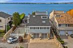 Welcome to this extraordinary waterfront retreat where luxury, comfort, and breathtaking views come together to create an exceptional living experience. Perfectly positioned to showcase unobstructed vistas of the Whitestone and Throggs Neck Bridges, this elegant residence offers a private dock, setting the stage for boating, jet skiing, paddleboarding or simply enjoying the tranquil rhythm of the water right from your backyard.Inside, an open-concept layout seamlessly blends sophistication with warmth. The chefâ€™s kitchen is a culinary dream, featuring pristine white cabinetry, high-end stainless steel appliances, and an oversized center island perfect for casual mornings or lively gatherings. Just beyond, a formal dining area with a magnificent chandelier flows into a sunlit living room, where expansive windows frame mesmerizing water views and an architectural beam adds a unique charm.The main living area is filled with natural light and rich wood flooring, centered around a striking stone fireplace. Downstairs, a fully finished ground-floor recreation room offers the ultimate flex space complete with surround sound, a second stone fireplace, and direct access to the outdoor patio perfect for movie nights, entertaining, or unwinding after a day on the water.The primary suite is a private sanctuary, wrapped in glass and featuring a skylight and panoramic views that greet you each morning. Step out onto either waterfront terraces, where thereâ€™s ample room for dining, lounging, and soaking in the scenery.Whether you&rsquo;re entertaining guests under the stars, launching your boat from your own dock, or enjoying morning coffee with a view, this home offers a lifestyle thatâ€™s truly unmatched. Donâ€™t miss this rare opportunity to own a piece of waterfront paradise.