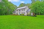 If peace, quiet and privacy are what you desire, look no further than this meticulously kept 3.74-acre property located at the end of a quiet cul-de-sac with no thru traffic. Landscaped gardens, mature shade trees, a stamped concrete patio with fire pit (2017) & an abundant wildlife complete this backyard oasis. Great for entertaining or just relaxing and taking in the morning sun rise. The center hall colonial home boasts 3176 sqft. of living space. 4 bedrooms, 3 full bathrooms, and 2 finished rooms with closets over the garage; These are perfect for a home office, craft room, dressing room or exercise room. The primary bedroom has a private bath and a large walk-in closet. The lower level has a gorgeous hardwood floor entry way with a coat closet, great room with hardwood floors, soaring fireplace and sky lights; a very spacious eat in kitchen, formal living room, a hardwood floor formal dining room, a mudroom / laundry room with access to both the garage and backyard plus a full bath. The home boasts closets galore, a dedicated pantry closet, central vacuum and 2 separate staircases that bring you up/downstairs. One from the entry way and one from the laundry room. There is a full, unfinished basement (also with 2 separate staircases) for easy entry and exit. Large windows and sliders allow ample light to enter, making even a gloomy day bright. There is no wasted space in this home! The attached oversized garage and shed increase your storage ability. The home is less than 7 minutes from all three Wallkill schools. Impeccably maintained and ready to move in, this home combines timeless appeal with modern conveniences. Solar panels were installed in 2023 and are owned and paid for, saving money on the electric bill. New oil tank installed 2025, 2021 new garage doors and openers, 2022 new roof and gutters fitted with leaf guards with 25-year warranty, 2024 central ac units serviced, heating and septic systems are maintained annually. Donâ€™t miss this rare opportunity to make this exceptional property your own.
