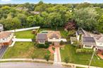 Welcome to this unique and spacious split-level home, perfectly situated on a generous 13, 500+ sq ft lot. With multiple living areas, a beautifully landscaped yard, and exciting bonus features, this property offers endless possibilities for comfortable living and future value. The main level features a bright entry foyer leading up to a sun-filled living room, formal dining area, and a well-appointed kitchen with sliding glass doors that open to a large deckâ€”perfect for hosting summer BBQs or simply relaxing while overlooking the park-like backyard. The upper level includes three generously sized bedrooms and a renovated full bathroom, with ample closet space and walk-up attic access for additional storage or expansion potential. Downstairs, the semi-finished basement offers a versatile space ideal for a family room, home office, gym, or play area. The home also includes a convenient laundry area with washer and dryer. Outdoors, enjoy a spacious backyard oasis complete with a large in-ground swimming pool (currently closed) that could be easily restored to its full glory with a little TLC. Bonus: Tesla charger installed. Assumable mortgage possibly available at a favorable interest rate for qualified buyers!