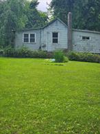 Wonderful opportunity for commercial land seekers with 2 bedroom rental home for immediate income. Land is level and easily expandable. Sold As Is Convenient location to highway, shops and schools.