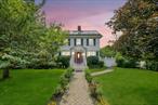 Welcome to this beautifully updated Colonial home in the heart of Albertson, offering the perfect blend of space, comfort, and modern convenience. This expansive residence features 4 generously sized bedrooms and 3.5 bathrooms, making it ideal for large or extended families. Abundant natural light pours in through multiple skylights, accentuating the elegant living room with a cozy fireplace, a formal banquet-sized dining area, and a gorgeous eat-in kitchen perfect for everyday living and entertaining. The main level includes a versatile bedroom and powder room, while the upper levels and a fully finished basement with waterproof flooring provide additional living space, bathrooms, a laundry area, and plenty of storage. Eco-conscious buyers will appreciate the paid-off solar panels, offering energy efficiency and long-term savings. Step outside to a spacious, fenced backyard with a large deck, ideal for gatherings and outdoor enjoyment. Additional highlights include a finished attic, 1-car attached garage, and an unbeatable location close to shops, transportation, schools, and more. Donâ€™t miss this exceptional opportunity to own a move-in-ready home in a prime location.