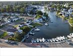 Wow!! Welcome to your waterfront oasis! Nestled on a serene canal, this rare gem offers 78 feet of bulkhead and three private boat slips, two of which can accommodate 30-foot vessels â€” a boaterâ€™s dream! Enjoy direct access from the street,  making getting on the water effortless. This spacious home features two full kitchens, four bedrooms, and three full baths, making it ideal for entertaining guests. A legal accessory apartment with proper permits provides added flexibility for rental income or multigenerational living. Inside, youâ€™ll find a cozy wood-burning fireplace, natural gas utilities, and room to relax and entertain. The large driveway fits up to four cars with ease. Whether youâ€™re seeking a full-time residence or weekend retreat, this home delivers a vacation lifestyle every day. Tucked away in a peaceful location yet close to everythingâ€”a hidden treasure for those who love life on the water. Interior sq footage is approximate.