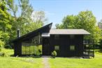 Architecture meets nature in Hillsdale.  A fully secluded getaway at the end of a private dead-end road on 7.3 pristine acres. This sunny 3-bedroom, 2-1/2 bath house is inspired by Scandinavian design and features 3 outdoor decks, with views of a spring-fed stream, a crystal clear pond, and deep green woodlands.  Central AC for summer days and a wood stove for snowy nights. An ideal layout for working from home and for guests, this well-maintained house includes a ground-level walkout room which would be ideal for a studio or for entertaining. Reimagined by a fashion editor and creative director, 10 minutes from Great Barrington and 7 minutes to the Catamount Ski Resort, this property is situated between the Berkshires and the City of Hudson, with endless shopping, food and cultural destinations.
