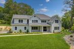 Set on a sprawling one-acre private lot, surrounded by Silver Lake Preserve, this beautifully crafted new home blends luxury and elegance in every detail. With over 6, 500 sq ft (including basement) of living space and an open floor plan, itâ€™s designed for both comfort and style.The main level features 9-foot ceilings with crown molding, a spacious living room, formal dining with Butlerâ€™s pantry, and custom cabinetry. The inviting family room with a fireplace opens to a gourmet eat-in kitchen with high-end finishes and appliances.Step onto the deck off the kitchen to take in the serene backyard viewsâ€”ideal for relaxing or entertaining.Upstairs, the primary bedroom suite is a private retreat with two walk-in closets and a spa-like bathroom. Four additional bedrooms, three full baths, and a laundry room complete the upper level.The finished, walk-out lower level offers a private guest suite with a full bath, a large recreation area, and generous storage, which can accommodate a future wine cellar.A three-car garage connects to a mudroom with a half bath, offering convenient access to the kitchen.Ideally located just minutes from downtown White Plains and both White Plains and North White Plains train stations, this home combines tranquility with accessibility.