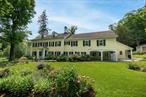 Offered for the first time in 35 years, Buxton Pond Farm is a rare and distinguished offering in the heart of Bedford Hills. Spanning 11 acres of rolling meadows, specimen gardens, and spring-fed waters, this historic gentlemanâ€™s farm reflects a blend of timeless elegance and meaningful provenance, set just minutes from the train station , local shops, schools and only 40 miles from Manhattan. At the center of the property stands a distinguished 1795 Colonial residence, meticulously preserved and exuding quiet sophistication. With six bedrooms and five full baths, the home features wide board pine floors, original fireplaces, a wood shingle roof and classic clapboard exterior. Gracious rooms offer garden views and open onto lawns anchored by heirloom rose beds and rare botanical specimens. The estate is further enriched by a stunning pool oasis, framed by rolling lawns and flowering borders. A suite of historic structures adds unmatched character and functionality, an 8-stall barn with a 2 bedroom private residence, a detached three-car garage, an antique chicken house and a greenhouse with attached office. The 1790 schoolhouse, now the oldest surviving in Bedford Hills, has been fully restored in 2023 and stands as a tribute to the propertyâ€™s layered past. Buxton Pond Farm has long been a sanctuary for notable American visionaries. It was the country home of DeWitt Clinton, former Governor of New York and architect of the Erie Canal. David Hosack, botanist and physician to Alexander Hamilton and Aaron Burr, also left his imprint here through his botanical collaborations with Clinton. In the 20th century, the property was home to pioneering television actress and writer Gertrude Berg, who chronicled her life at the farm in the acclaimed 2009 documentary Yoo-Hoo, Mrs. Goldberg. Additionally, this land once served as a stop on the Underground Railroad, with historic stone walls offering refuge to those seeking freedom. Today, Buxton Pond Farm continues its spirit of contribution through the Buxton Pond Farm Center. This learning hub offers immersive programming in herbalism, botany, and permaculture. In partnership with the Mount Kisco Interfaith Food Pantry, the Center&rsquo;s â€œGrowing Fieldâ€ initiative supplies fresh produce to local families in needâ€”bridging past and present through purposeful living. This is not just a residence, it is an opportunity to steward a living legacy. Elegant, historically significant, and culturally rich, Buxton Pond Farm is one of Bedfordâ€™s most iconic properties.