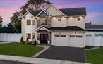 Discover sophisticated luxury at 4 Heron Court â€” a custom-built 4-bedroom, 2.5-bath colonial situated on a charming, private street in Levittown. As you step into the dramatic two-story entryway, youâ€™re immediately greeted by a stylish living room anchored by a sleek double-sided electric fireplace â€” perfect for entertaining or unwinding in style. The designer kitchen is a showpiece, featuring crisp white cabinetry, quartz countertops, gold hardware, and refined finishes that blend form and function effortlessly. A formal dining room and sitting area complete the main level, offering a perfect flow for both intimate dinner parties and large gatherings. Upstairs, retreat to your primary suite â€” a true sanctuary â€” with soaring vaulted ceilings, a sprawling walk-in closet, and a spa-like en suite bath adorned with custom tilework. The upper level also offers 3 generously sized bedrooms, convenient laundry, and a full attic for additional storage. Low HOA fees provide peace of mind, covering snow removal, common area, and street maintenance. Luxury, style, and ease â€” this is Levittown living at its finest. See it for yourself â€” this stunning home wonâ€™t last long!