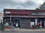 Commercial property for sale, 2 retail stores, 1 warehouse.Open floor plan, good potential.