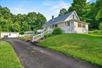 BIG PRICE DROP! MOTIVATED SELLER! MOVE-IN READY! . . . FANTASTIC 2, 500 square foot cape in Pine Bush School District on 1.1 acres with 4 bedrooms, a finished walk-out basement, a large backyard with an above-ground pool, and an oversized (24x40) garage with multiple rooms and even a mechanics bay! Also, NEW ROOF (2023), two newer (2022) Fujitsu ductless splits (heat pumps) for both heat and air conditioning with 10 year warranties, pool installed 2022, driveway resealed last fall (2024). Terrific location less than one mile off Route 17 for ideal commuting, also very close to schools, restaurants and all sorts of other amenities! Great curb appeal with the front deck that wraps around to back patio with pergola and fire pit and fenced in backyard . . . OTHER RECENT RENOVATIONS (2017) -- gorgeous kitchen with granite countertops and stainless steel appliances, refinished hardwood floors, updated bathrooms. Lots of other upgrades inside and out! Well maintained home. Main floor features living room, front sun room/office (4 season), kitchen, formal dining room, two bedrooms and a full bath. Upstairs is another two bedrooms. The finished basement includes a bar room (complete with bar), adjoining den area, half bath, storage room, and laundry area. Expansive garage is impressive in size, and also great for storage, crafts, home projects, and so much more. A lot of home for the price! Move right in and unpack!
